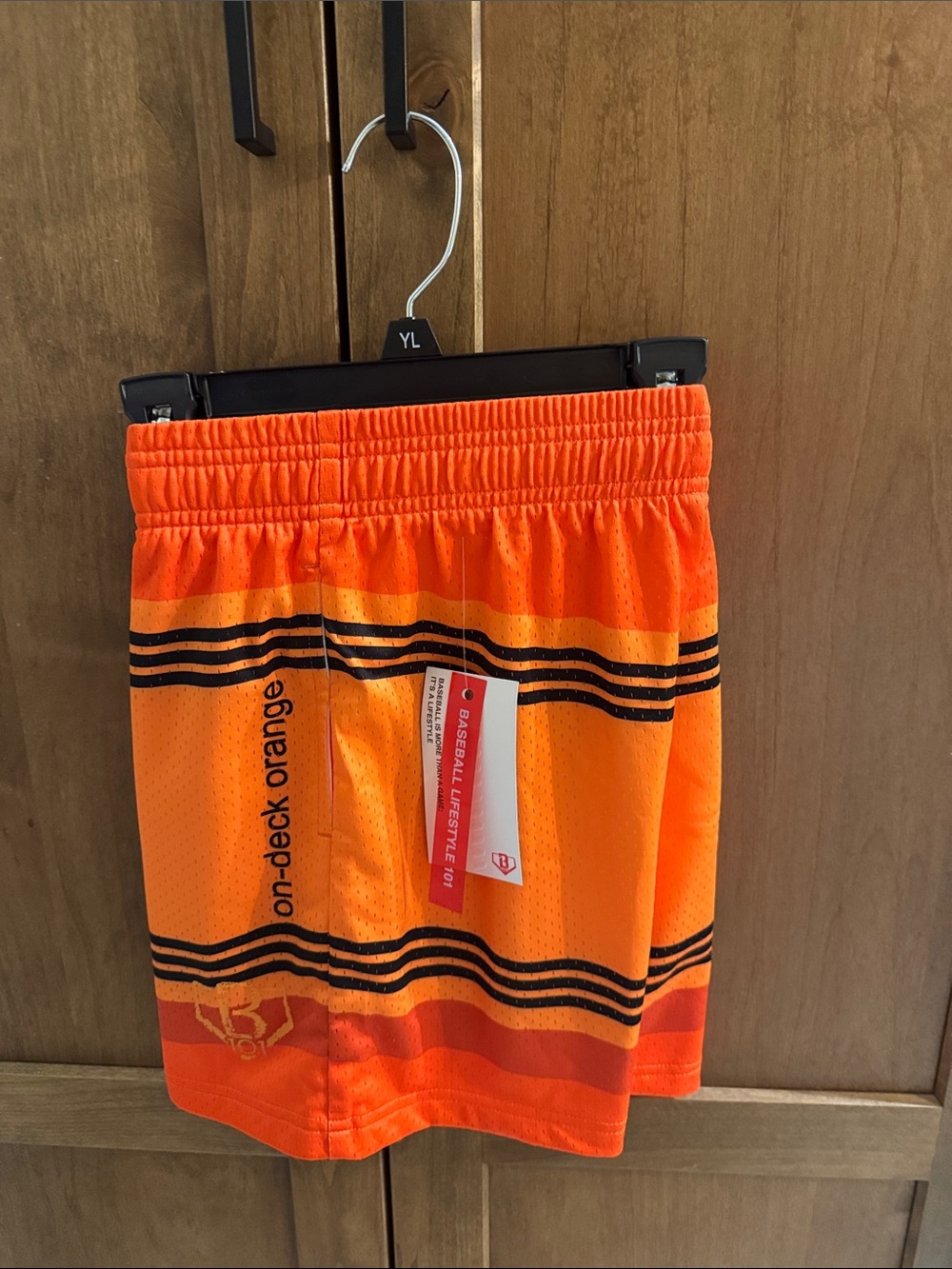 Kids' crayon On-Deck Orange Athletic Shorts with Black Stripe Detail